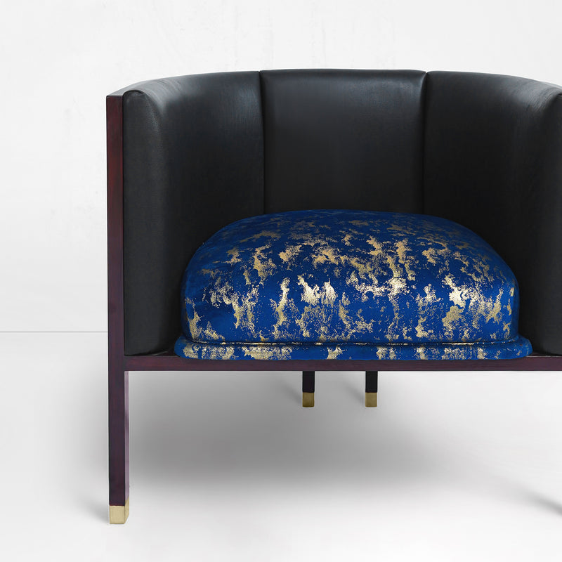 Erete single chair in blue/ gold velvet seat and black leather backrest