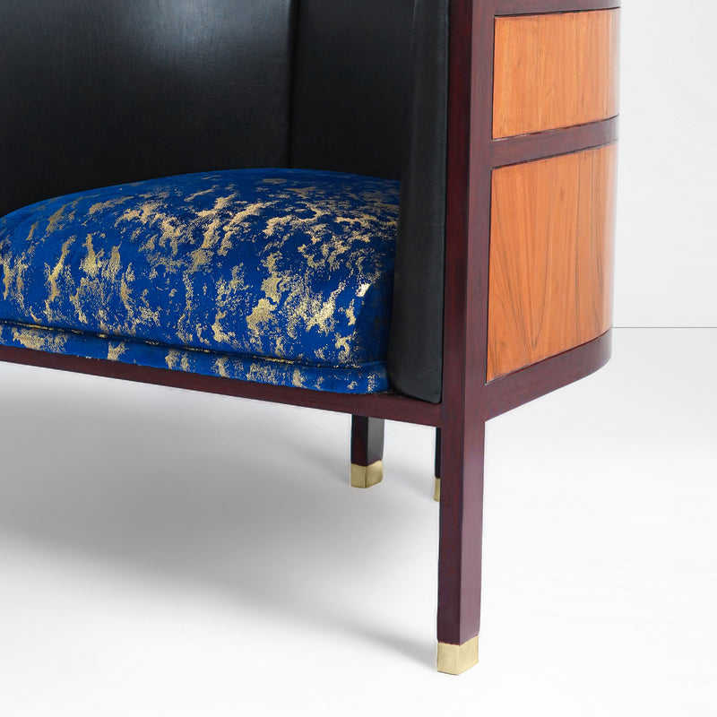 Erete single chair in blue/ gold velvet seat and black leather backrest