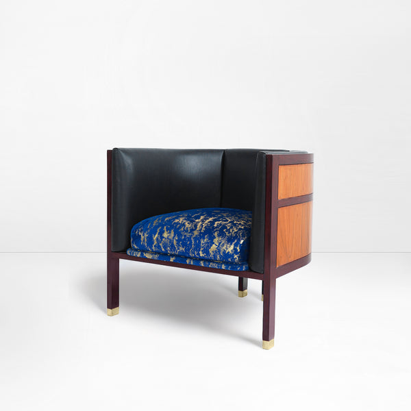 Erete single chair in blue/ gold velvet seat and black leather backrest